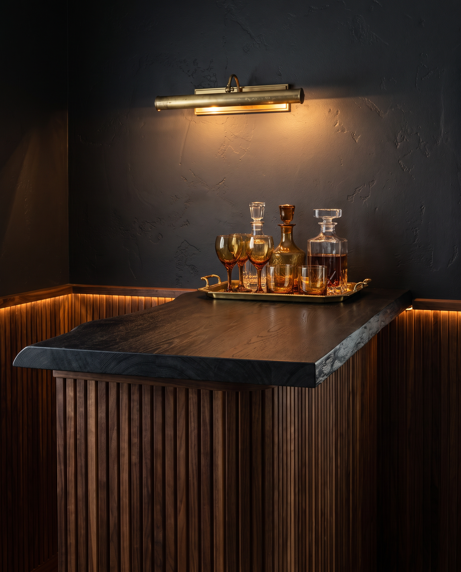 Solid black oak countertop, live edge — a moody home cocktail bar