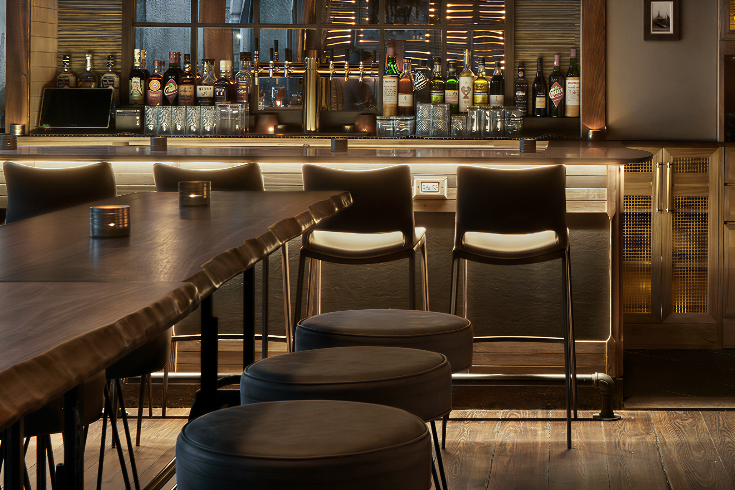 Live edge walnut restaurant tables installed at Main Street Landing, showing warm tone and grain variation in a hospitality setting
